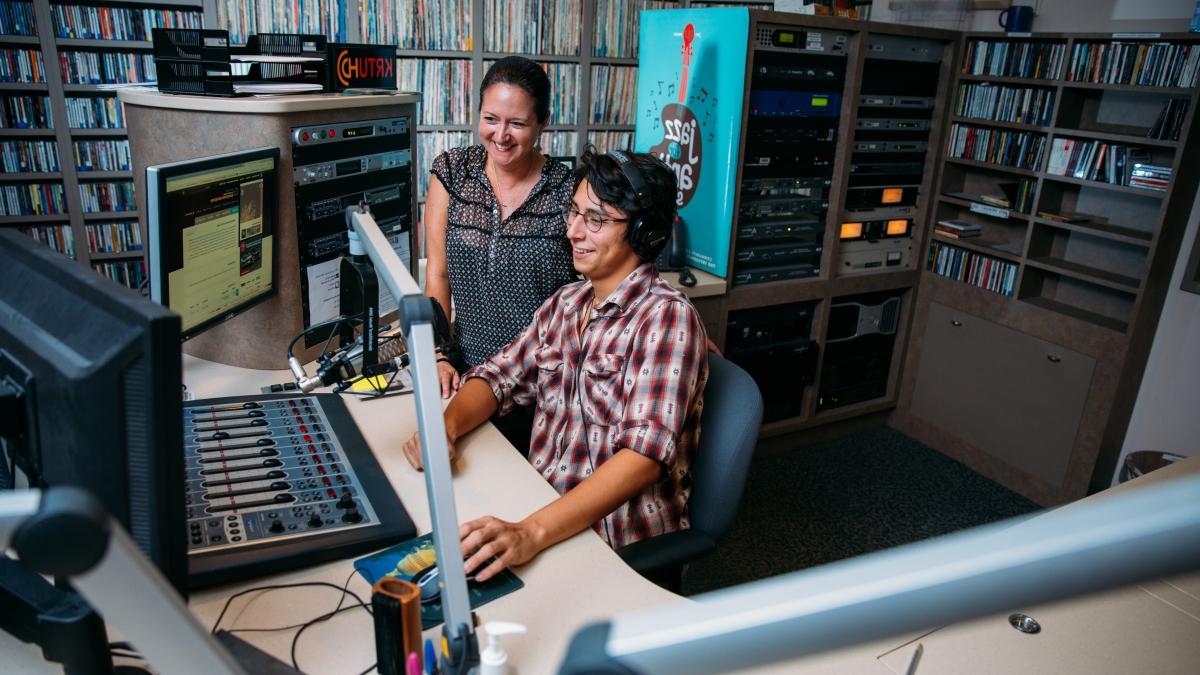 a professor and student in the KRTU recording studio